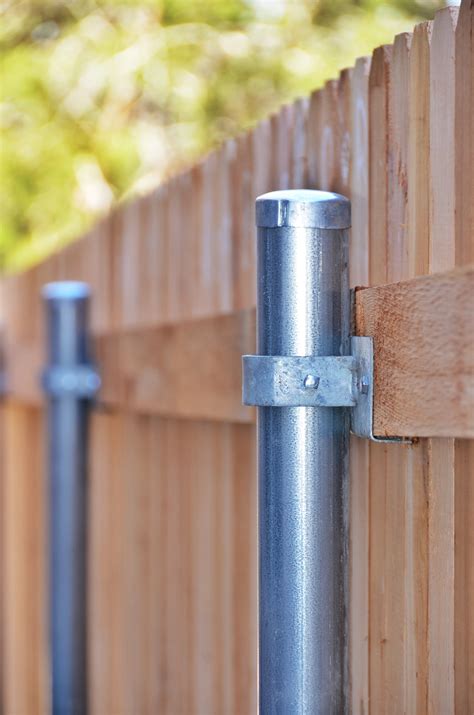 installing metal posts next to house|how to install fence posts.